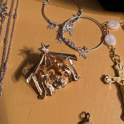 Crosses and religious jewelry including a beautiful rosary