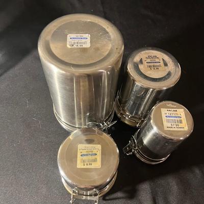 Ten Canisters With Flip Top Lids (K-MG)