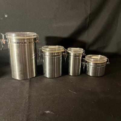 Ten Canisters With Flip Top Lids (K-MG)