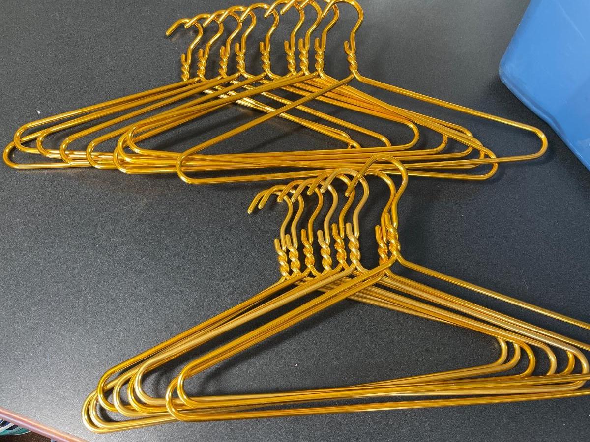 21 Gold metal hangers