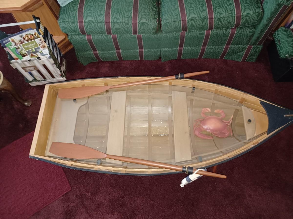 glass top row boat coffee table