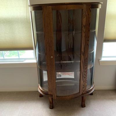 Rounded curio cabinet