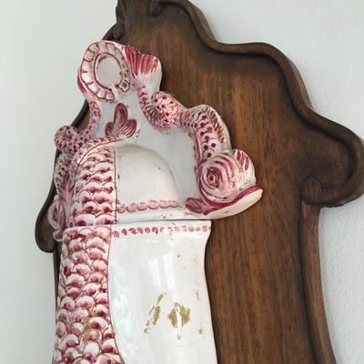 Vintage wall decorative fish fountain.