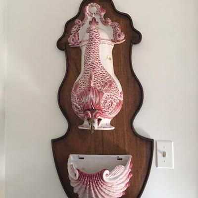 Vintage wall decorative fish fountain.