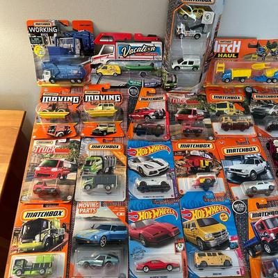 52 Hot Wheels, Matchbox Cars, and Track