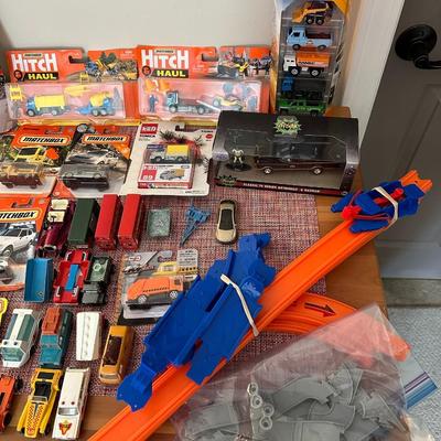 52 Hot Wheels, Matchbox Cars, and Track