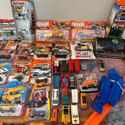 52 Hot Wheels, Matchbox Cars, and Track