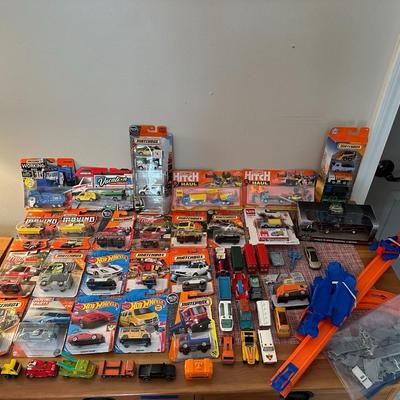 52 Hot Wheels, Matchbox Cars, and Track
