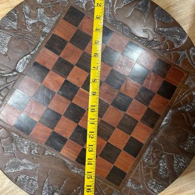 Wood circle decor with checkerboard on back