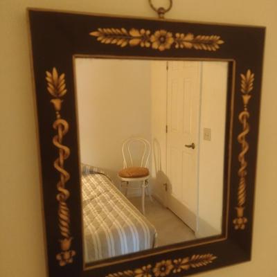 Framed Wall Mirror with Black Base Coloring and Gilded Leaf Accents