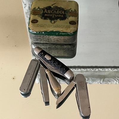 UB1207 Lot of Pens Pocket Knives and Antique Arcadia Tin