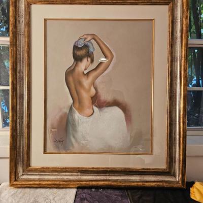 Large Nude putting an icepack on her head