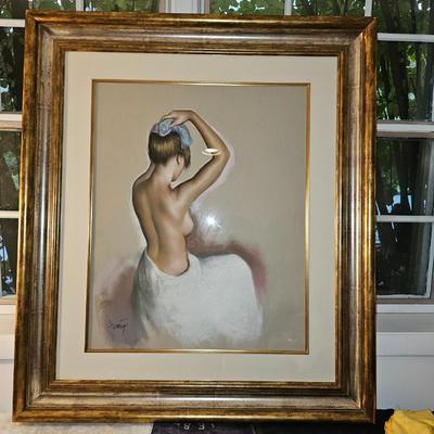 Large Nude putting an icepack on her head