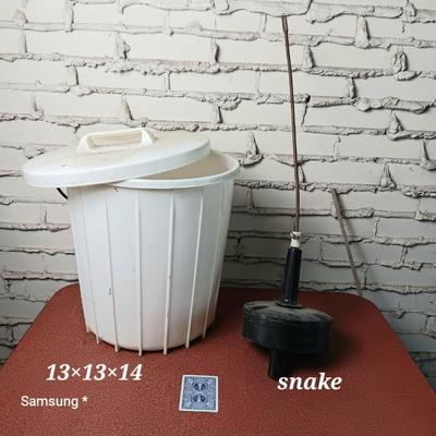 Drain Snake and Trash Can