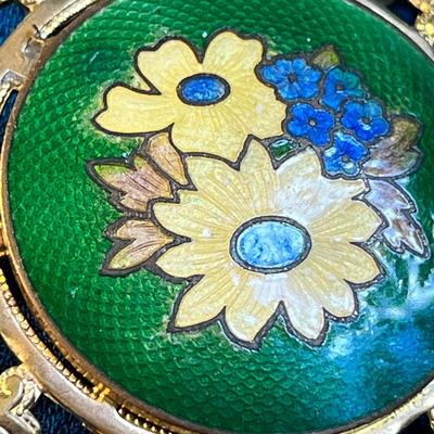 FANCY ROUND ENAMELED FLORAL BROOCH WITH GOLD TONE OPEN WORK BORDER