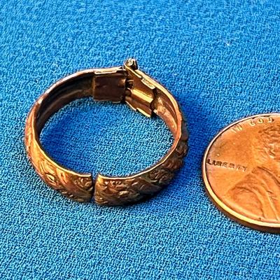 UNUSUAL COPPER HINGED RING? CLIP? WITH RAISED FLORAL DESIGN