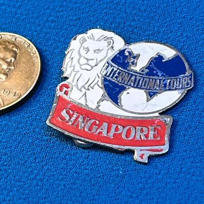 ENAMELED â€œSINGAPORE INTERNATIONAL TOURSâ€ PIN