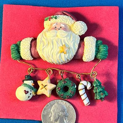 SANTA HOLDING STRING OF ORNAMENTS PIN