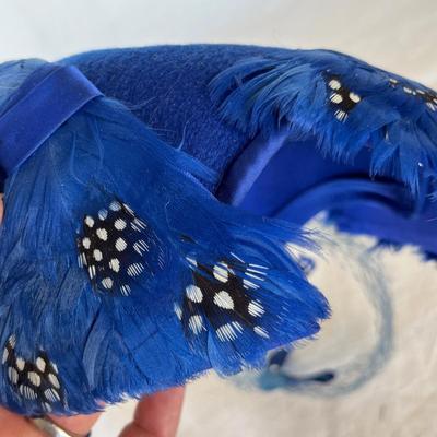 Blue feather over the head hat