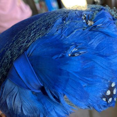 Blue feather over the head hat
