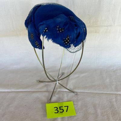 Blue feather over the head hat