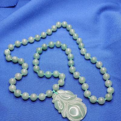 Lovely green jade necklace with plum pendant