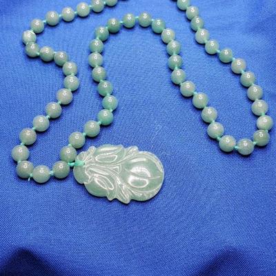 Lovely green jade necklace with plum pendant