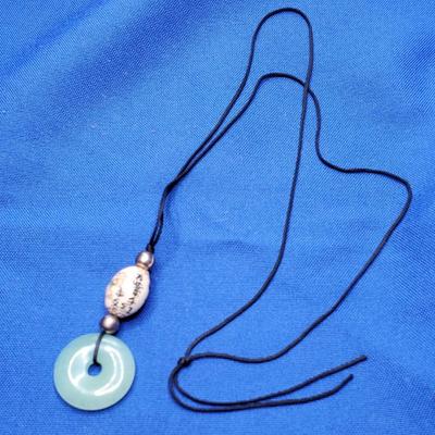 Jade circlet and painted bead on silk strand