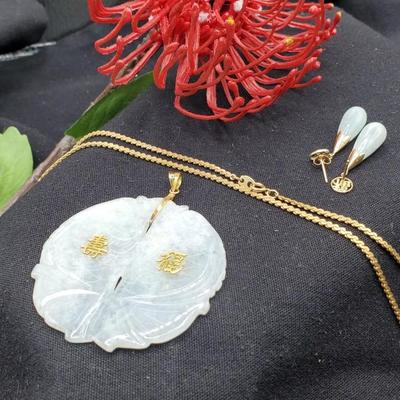 Exquisite pale jade medallion with gold accents