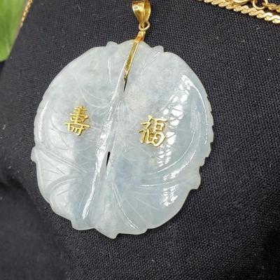 Exquisite pale jade medallion with gold accents