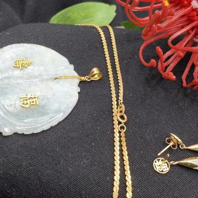 Exquisite pale jade medallion with gold accents