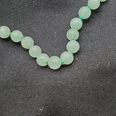 Pale green jade necklace hand tied with green cording