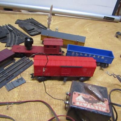 Collection of Model Railroad Cars, Tracks, and Accessories