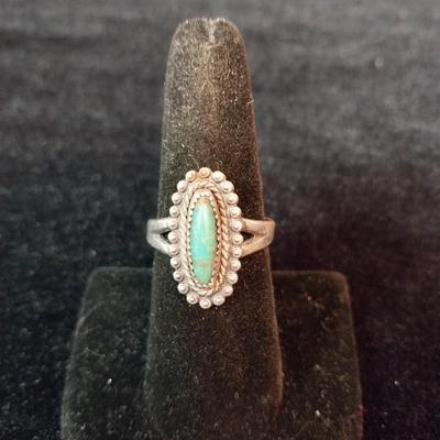 SIGNED STERLING SILVER AND TURQUOISE RING