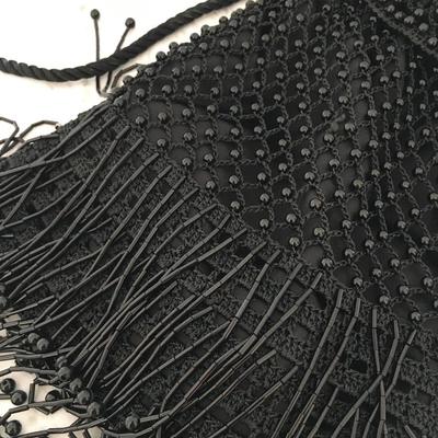 Black beaded sling purse.