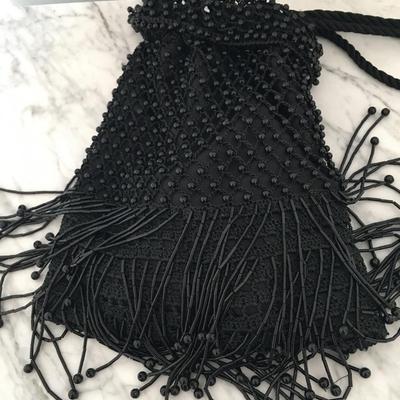 Black beaded sling purse.