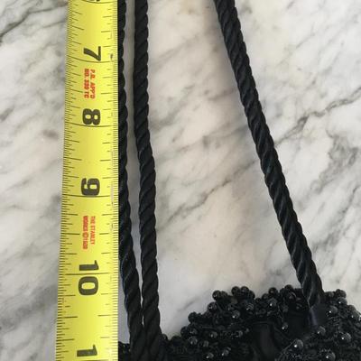 Black beaded sling purse.