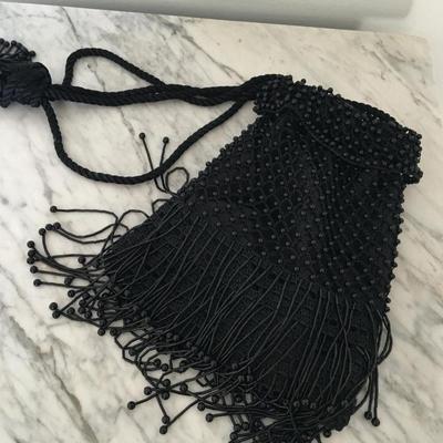 Black beaded sling purse.
