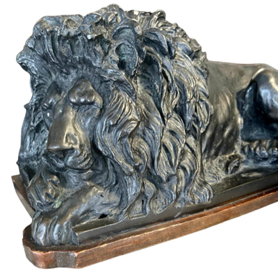 Bronze Recumbent Lion on wood stand