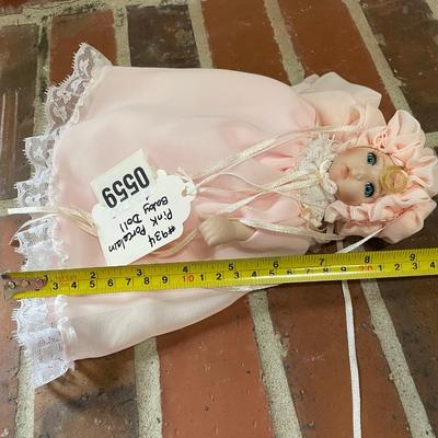 Pink porcelain baby doll