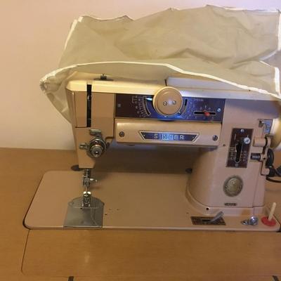 Singer 401A sewing machine in cabinet