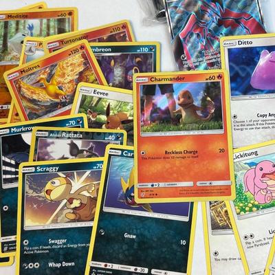 Mixed Lot of Loose POKEMON Card with Bonus Card Sleeves