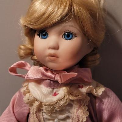 Vintage Porcelain Doll with Pink Dress