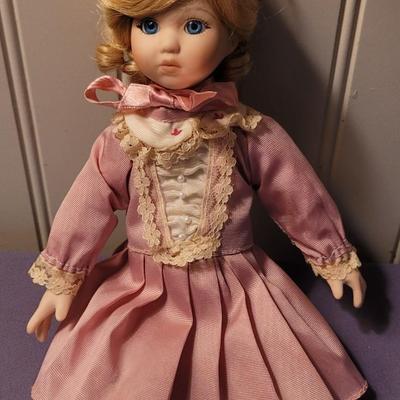 Vintage Porcelain Doll with Pink Dress