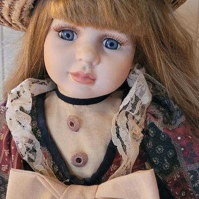 Vintage Porcelain Doll with Straw Hat and Basket