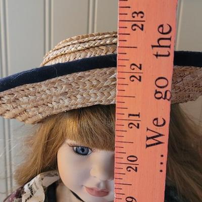 Vintage Porcelain Doll with Straw Hat and Basket