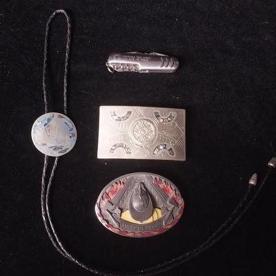 2 BELT BUCKLES, BOLO TIE AND A MULTI FUNCTION KNIFE