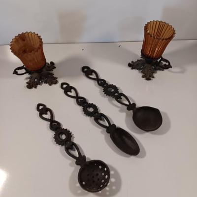 Cast Iron candle sconces with three vintage Cast Iron Triple Heart Kitchen utensils.
