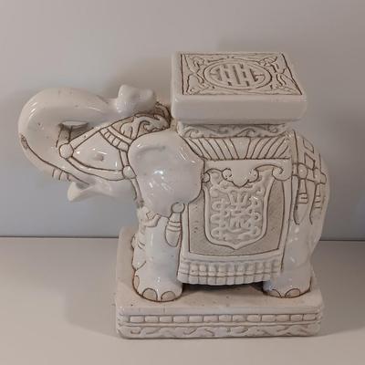 Vintage tabletop ceramic elephant plant stand with smaller chalkware elephant.