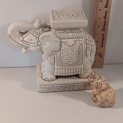 Vintage tabletop ceramic elephant plant stand with smaller chalkware elephant.